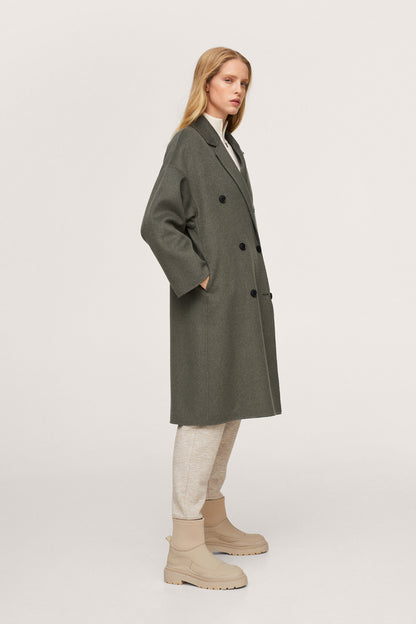 Dark green long double-breasted coat with button front and notched collar