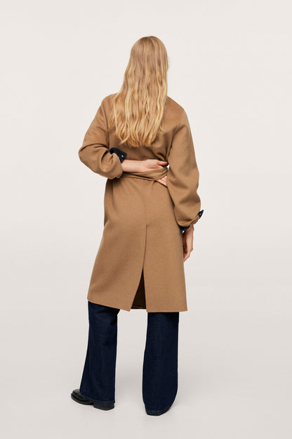 Tan long belted coat, back view, tied waist and dark cuff details