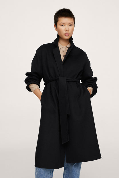Black long belted coat with notch lapels and front button closure