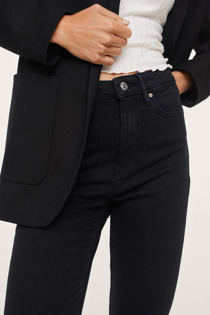 MANGO black denim jeans waistband close-up with button and belt loops
