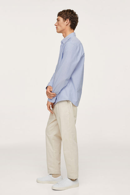 Sky blue button-up shirt side profile, long sleeves and buttoned collar