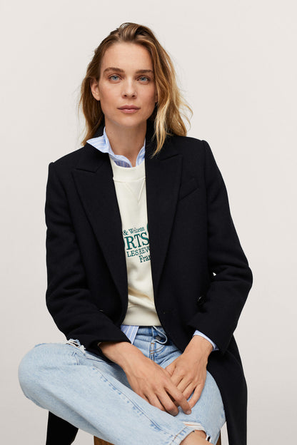 Black tailored blazer with lapels and two-button front, long sleeves, structured fit