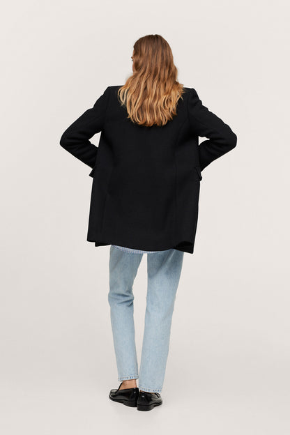 Black long coat, back view with side pockets and long fitted sleeves
