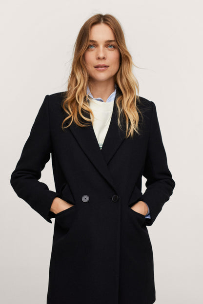 Black double-breasted tailored blazer with notch lapels and two-button front