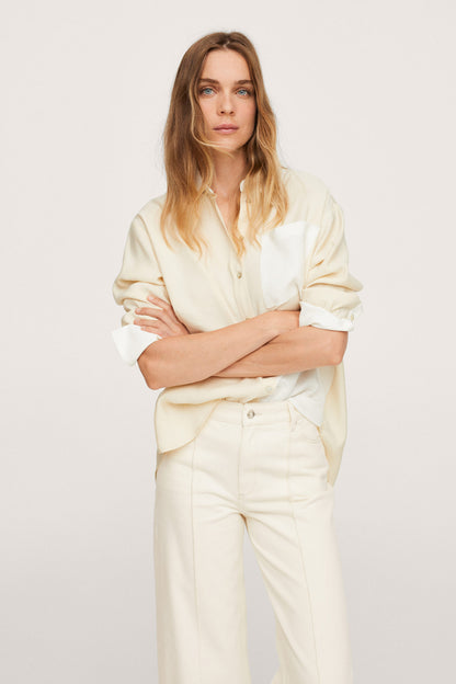 Ecru button-up shirt and wide-leg trousers set, front view with arms crossed