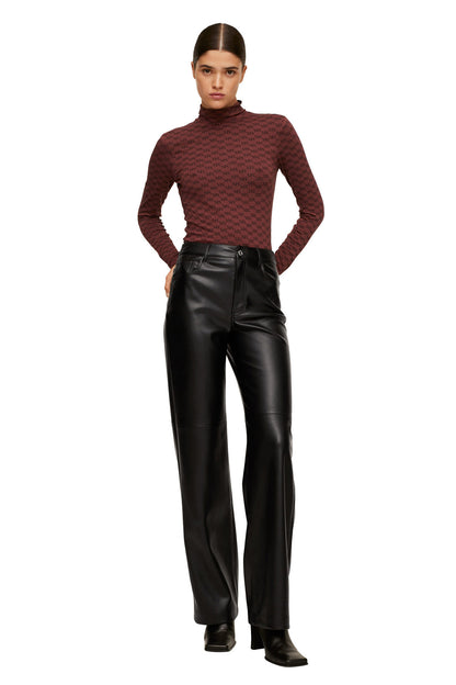 Burgundy patterned turtleneck top with long sleeves and black leather-look trousers
