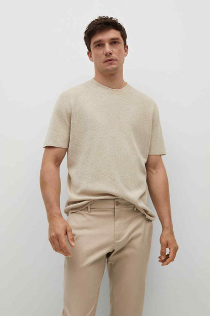 Men's beige chinos with belt loops and buttoned front, straight leg