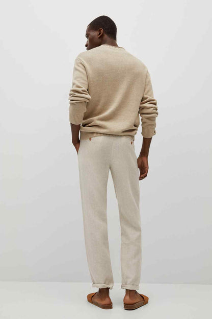 Ecru trousers with relaxed straight legs and back yoke, button closure.