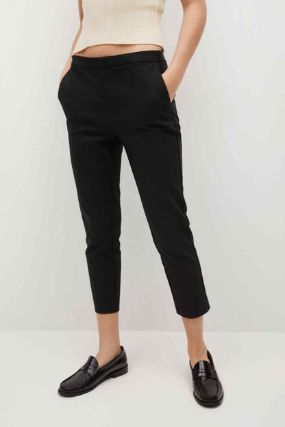 Black cuffed slim trousers with front pockets