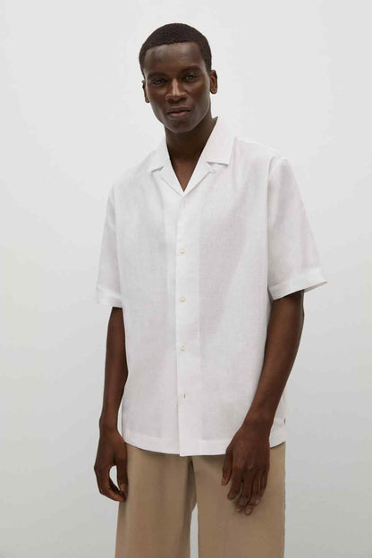 White short-sleeve button-up shirt with V-neck collar and button placket