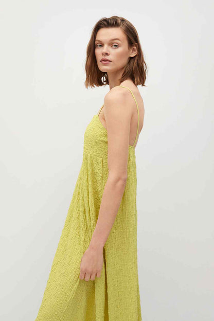 Green textured cami dress with thin straps and gathered skirt, side view