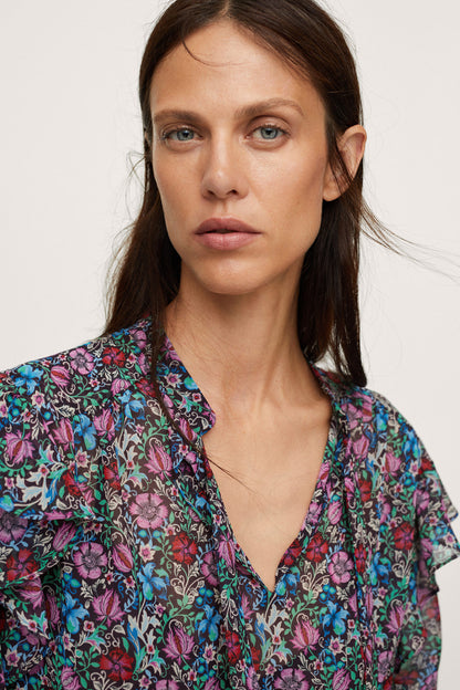 Floral long-sleeve blouse with V-neck and ruffled shoulders