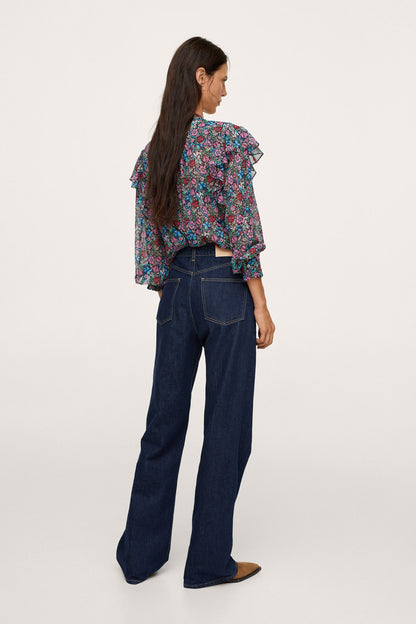 Floral long-sleeve blouse with ruffled shoulder detail, side view