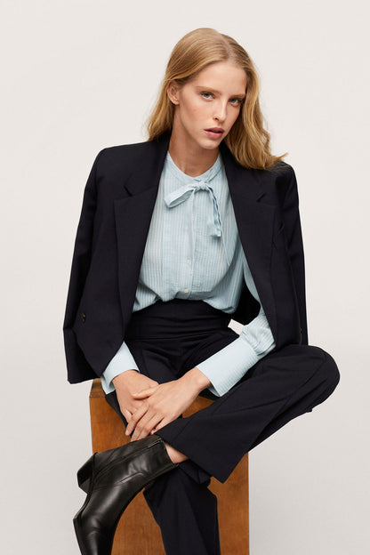Light blue striped blouse with bow-neck tie and long sleeves