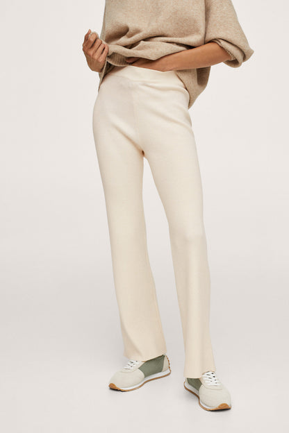 MANGO vanilla cropped sweater hem over cream straight-leg pants