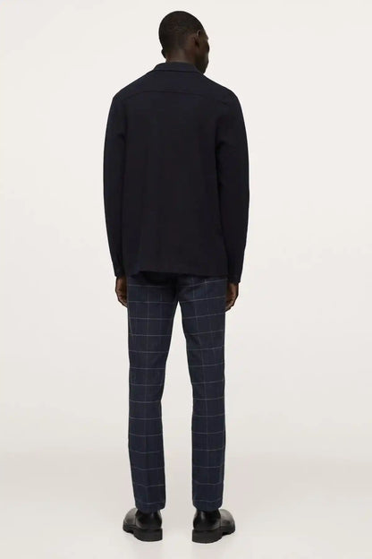 Men's dark navy windowpane check trousers from back view, straight-leg