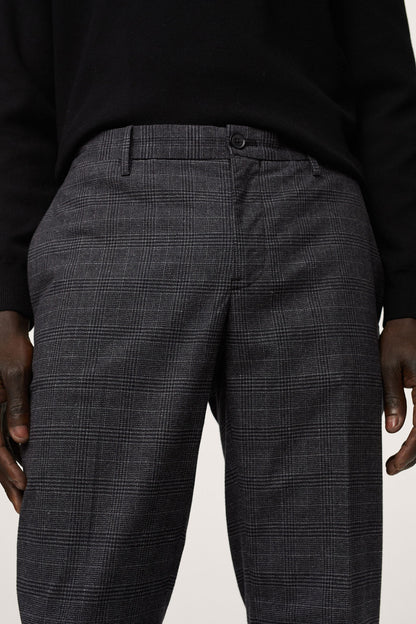 Dark heather grey plaid trousers waistband with belt loops and front button.