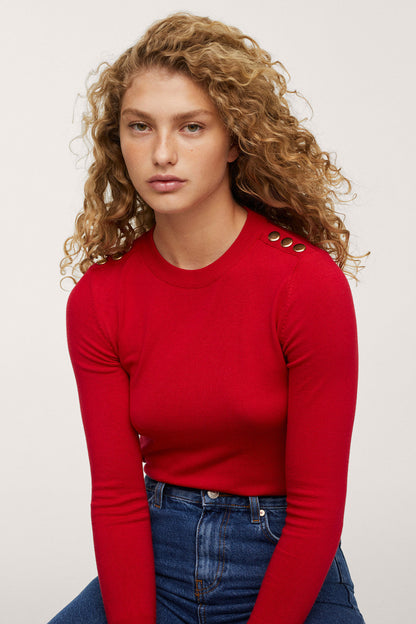 Red long-sleeve crew-neck top with blue high-rise jeans, front view