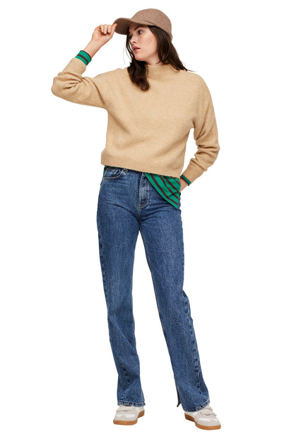 Beige sweater with ribbed neckline and green striped cuffs, relaxed fit