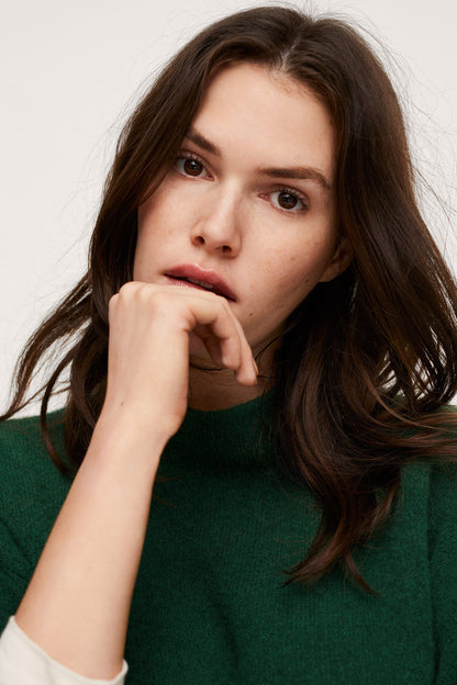 Dark green knit sweater with crew neck and ribbed collar detail