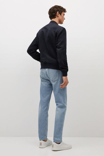 Dark navy zip-up jacket, stand collar, back view