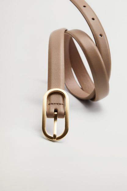 Light pastel brown belt with gold buckle frame and pin, angled close-up