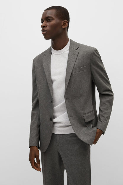Men's light heather grey blazer with front pocket and button closure, side view
