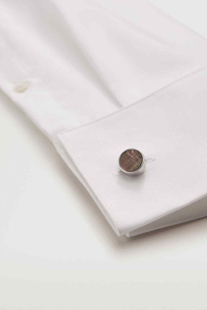 MANGO cufflinks on white shirt cuff with round iridescent disc
