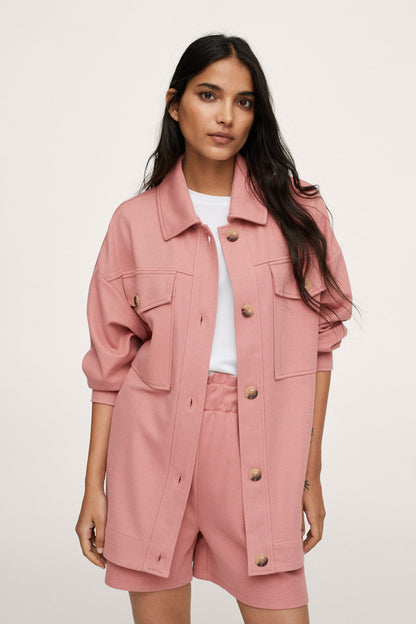 Pink button-up jacket with flap pockets and front gold-tone buttons