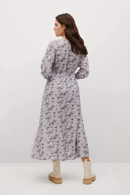 Pastel purple floral midi dress from side view, V-neck and puff sleeves