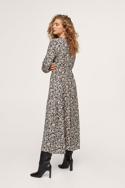 Black and white floral maxi dress with V-neck, long sleeves, flowing skirt