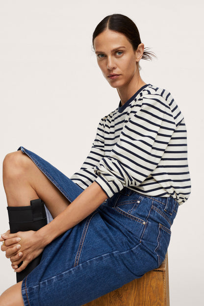 Dark blue denim midi skirt with front button and angled seam details