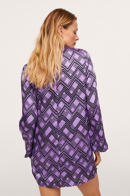 Lilac zigzag long-sleeve mini dress, side view with loose swing hem