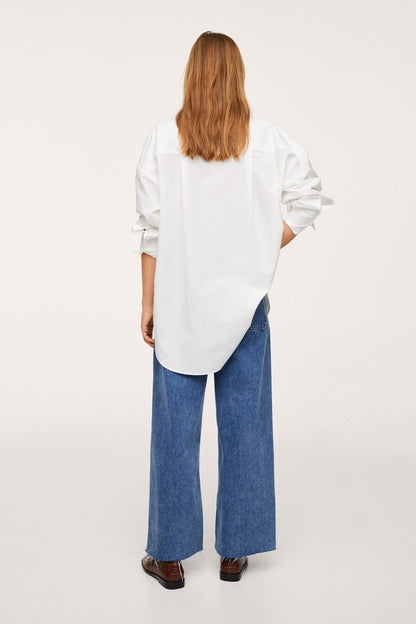 Off-white long-sleeve blouse with gathered cuffs, back view
