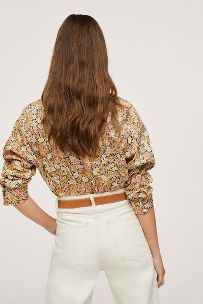 Yellow floral blouse, back view, gathered shoulders and long sleeves
