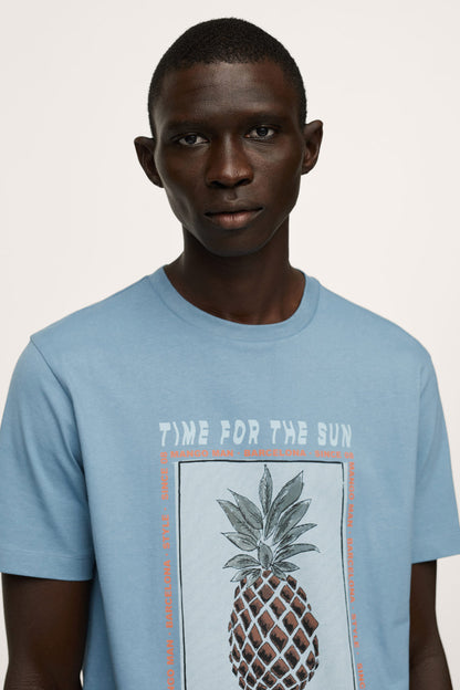 Blue crew-neck T-shirt with pineapple graphic and slogan front