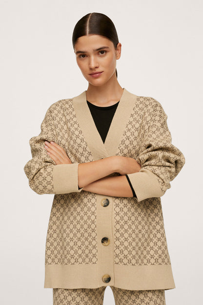 Beige patterned button-front blazer with matching trousers, front view
