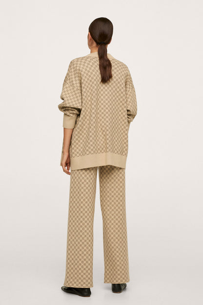 Beige patterned blazer and wide-leg trousers, back view