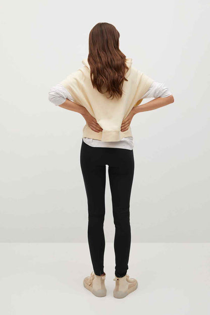 Black slim-fit pants, full length with tapered leg