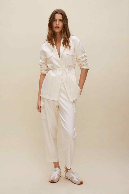 Ecru cropped trousers with drawstring waist and cuffed legs