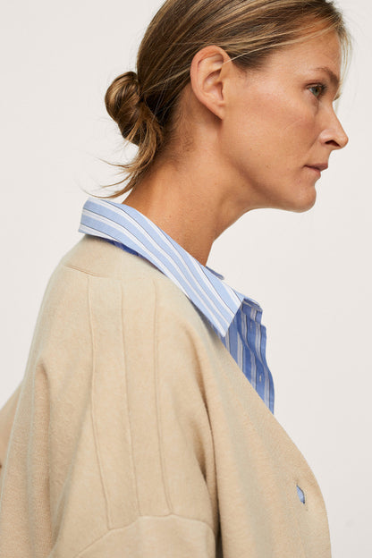 Beige button-front jacket with notched collar and chest pocket detail