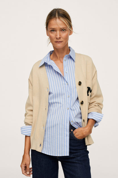 Beige button-front jacket with striped shirt, front view, button closure and pockets