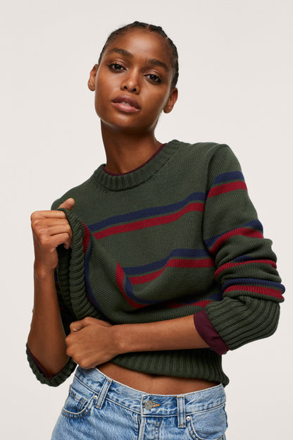 Green striped knit sweater close-up, red and blue horizontal stripes, ribbed cuffs