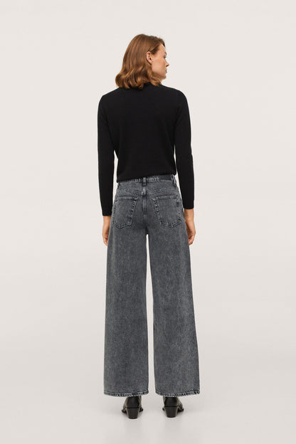Black crewneck long-sleeve sweater with grey wide-leg jeans, back view