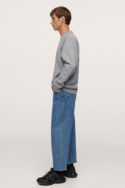 Heather grey long-sleeve crewneck sweatshirt, side view