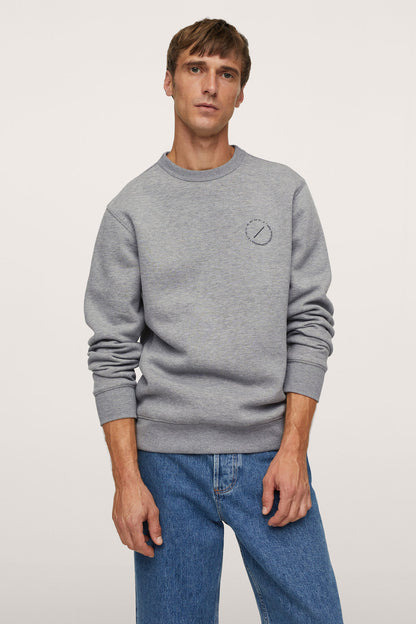 Medium heather grey crewneck sweatshirt with small chest logo patch
