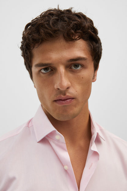 Men's pastel pink dress shirt, close-up of collar and button placket