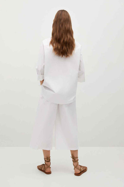MANGO off-white button-up shirt and wide-leg trousers, back view