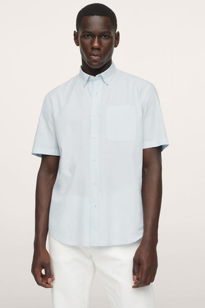 Men's light blue short-sleeve button-up shirt, front view with chest pocket