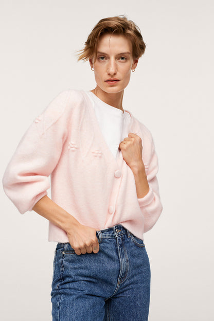 Pastel pink knit cardigan with button front and rounded neckline
